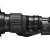 The image shows a Canon CJ15EX4.3B-IASE-S zoom lens, with a focus on its detailed markings, mounted on a camera body designed for 4K video recording.